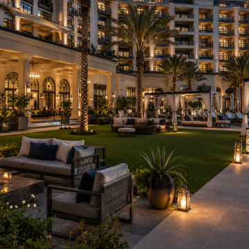 Commercial Hospitality. Artificial Grass. Elegant resort courtyard at dusk
